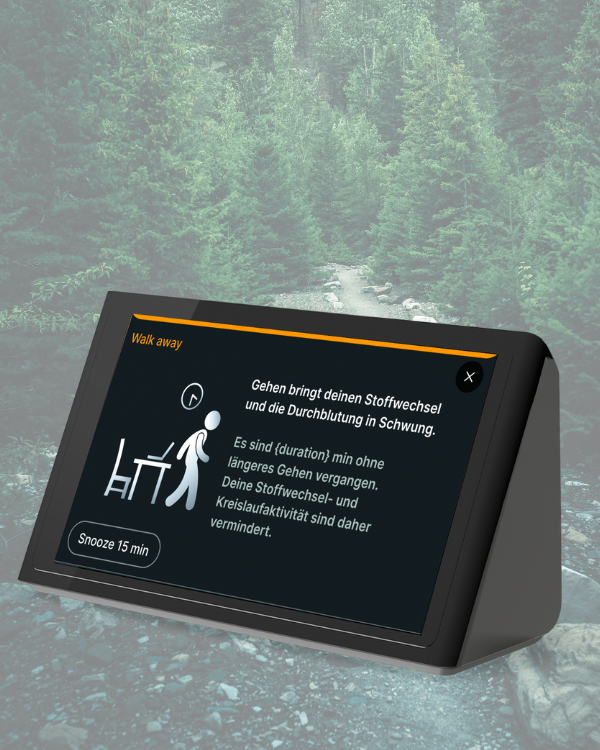 Ein Schreibtisch auf welchem eine Isa und ein Smartphone mit der Deep Care App zu sehen ist. 
